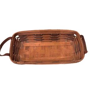 This is a vintage Longaberger Woven Basket with leather Handles